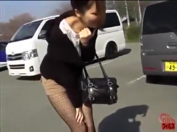 Fashionable Japanese doll pees her shorts outdoors