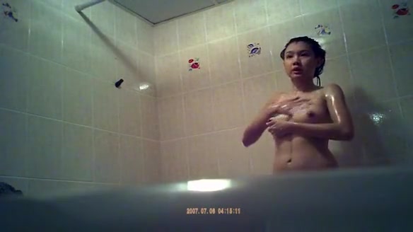 Asian woman spied showering in bathtub